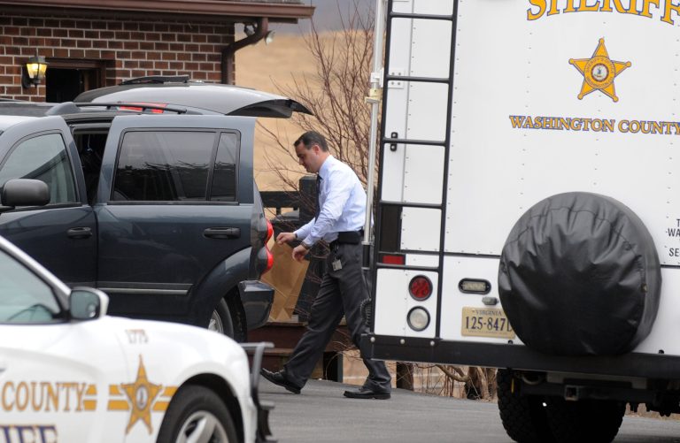 Investigators with the Washington County Sheriff's Department work the scene of a multiple homicide, Tuesday, Feb. 25, 2014, near Glade Spring, Va. (AP Photo/Bristol Herald Courier, David Crigger)