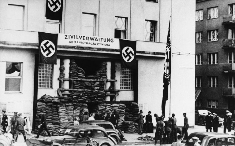 German soldiers hoisting the German army flag, Sept. 19, 1939 in front of the City Hall of Gdynia, Poland, the seat of the civil administration. (AP Photo)