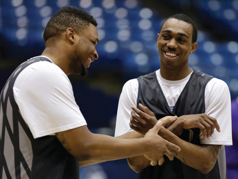 Al Behrman/AP
James Madison's Rayshawn Goins, left, and Devon Moore were AAU teammates in Ohio along with fellow Duke A.J. Davis.