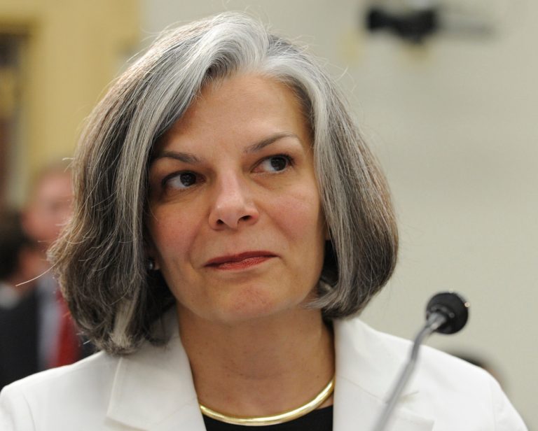   FILE - In this July 31, 2008 file photo, Centers for Disease Control and Prevention (CDC) Director Julie Gerberding prepares to testify on Capitol Hill in Washington. Gerberding, now president of Merck & Co.'s vaccine unit, commenting on a study about medical salary inequities published Wednesday, June 13, 2012 in the Journal of the American Medical Association, says women tend to be less aggressive at self-promoting than men, a possible reason top women researchers get paid substantially less than their male counterparts. (AP Photo/Susan Walsh, File)  