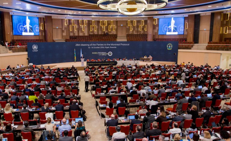 Former Secretary of State John Kerry, center-left at podium, delivers a speech to the 28th Meeting of the Parties to the Montreal Protocol on Substances that Deplete the Ozone Layer, in Kigali, Rwanda, on Oct. 14, 2016. Nations strove for a deal to phase out hydrofluorocarbons from air conditioners and refrigerators as part of efforts to fight climate change. (AP Photo)