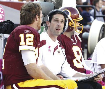 Jennifer Milbrett/The Washington Examiner
Quarterback John Beck, left, will get the start over Rex Grossman on Sunday when the Redskins play the Panthers.