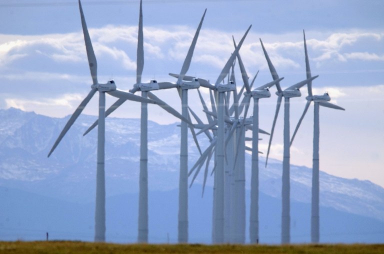 FILE - In this Oct. 10, 2002 file photo, turbines blow in the wind south of Cheyenne, Wyo. An alliance of four companies proposed an $8 billion project Tuesday, Sept. 23, 2014 that within a decade could send wind power generated near Chugwater, Wyo., sleepy ranching town of 216 residents north of Cheyenne, to households in Southern California. (AP Photo/David Zalubowski, File)