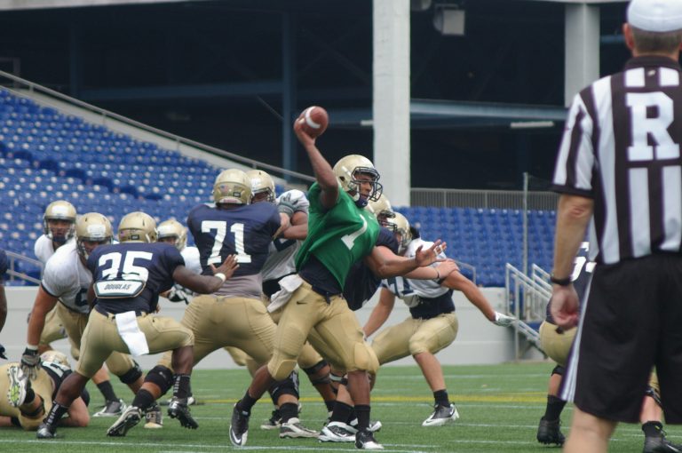  Junior quarterback Trey Miller completed 13 of 19 passes Saturday in Navy's scrimmage. / Photo by Kevin Dunleavy 