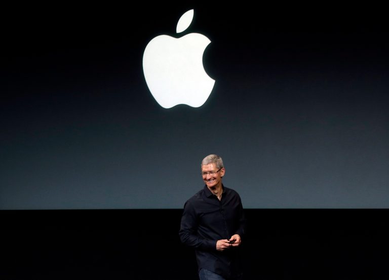 FILE - In this Tuesday, Sept. 10, 2013, file photo, Apple CEO Tim Cook speaks on stage before a new product introduction in Cupertino, Calif. Apple is poised to reveal its next big thing Tuesday, Sept. 9, 2014, in a crucial attempt to prove its technological tastemakers still have the power to mesmerize the masses. (AP Photo/Marcio Jose Sanchez, File)