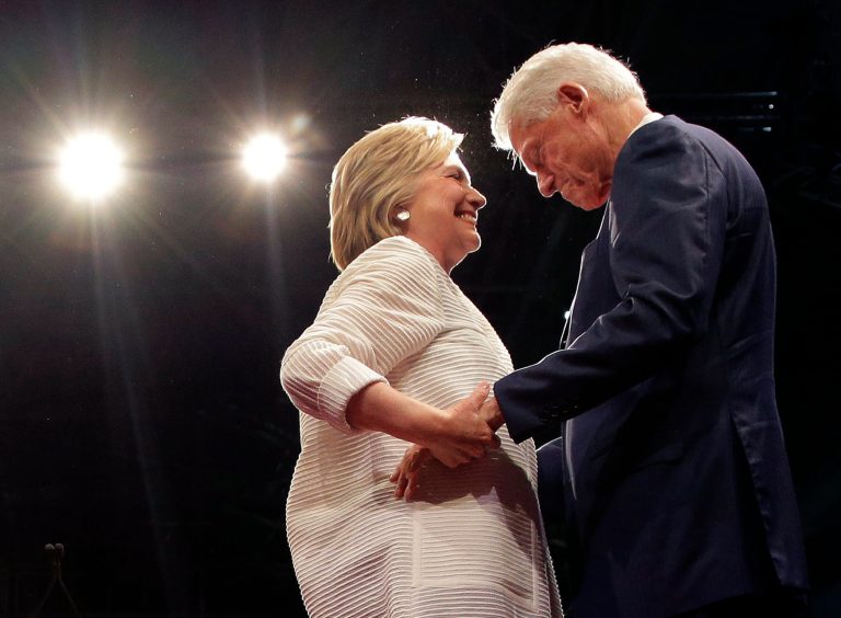 Democratic presidential candidate Hillary Clinton, second from right, greets her husband, former president Bill Clinton, during a presidential primary election night rally on June 7 in New York. (AP Photo/Julie Jacobson)