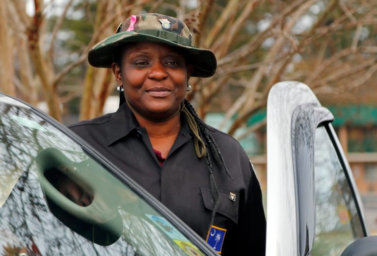   In this photo taken Dec. 13, 2012 JD Brunson poses for a photo outside a restaurant in Columbia, S.C. If Congress and President Barack Obama don't agree on spending cuts by Jan. 1, a package of across-the-board cuts would take effect that would hit the military heavily. Brunson, 47, whose 56-year-old husband retired as a master sergeant after 24 years in the Air Force, says they contribute $41 per month to their military health insurance. (AP Photo/Chuck Burton)  