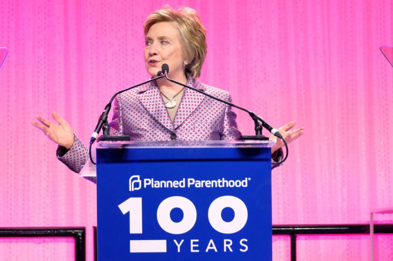 In the Hillary Clinton campaign case, the Postal Service relieved union members of their postal duties for weeks at a time and encouraged employees to do union-funded work for various Democratic candidates while on leave, even in the face of local post office managers' complaints of understaffing. (Photo by Charles Sykes/Invision/AP)