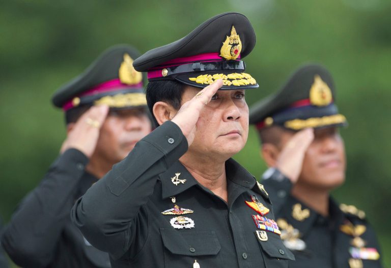 Thailand's new Prime Minister Prayuth Chan-ocha salutes during an establishment anniversary of the 21st infantry regiment, Queen's Guard, in Chonburi Province, Thailand, Thursday, Aug. 21, 2014. Three months after overthrowing Thailand's last elected government, this Southeast Asian nation's junta leader is stepping out of his army uniform for good - to take up the post of prime minister in a move critics say will only extend his time at the helm and consolidate the military's grip on power. (AP Photo/Sakchai Lalit)