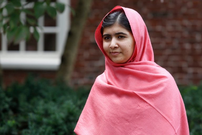 Malala Yousafzai listens as Harvard President Drew Gilpin Faust introduces her to reporters at Harvard University in Cambridge, Mass. (AP/Jessica Rinaldi)
