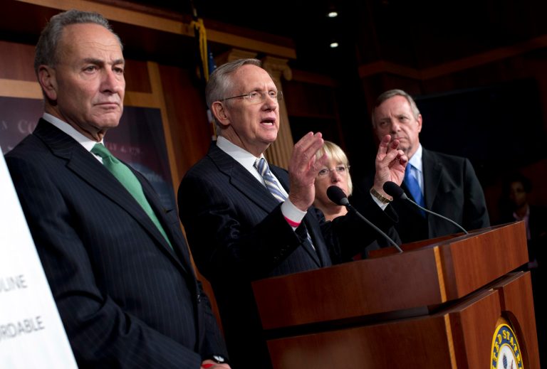 Senate Majority Leader Sen. Harry Reid, D-Nev., gestures during a news conference with, from left, Sen. Chuck Schumer, D-N.Y., Sen. Patty Murray, D-Wash., and Sen. Dick Durbin, D-Ill., after passing a bill to raise the debt ceiling and fund the government on Capitol Hill on Wednesday, Oct. 16, 2013 in Washington. (AP Photo/ Evan Vucci)