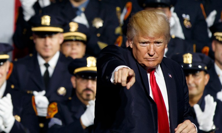 President Trump offered his condolences to the Kissimmee, Fla., police force and their loved ones after two officers were shot Friday evening. (AP Photo/Evan Vucci)