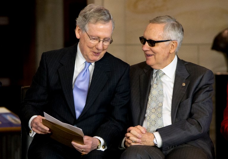 Senate Majority Leader Mitch McConnell, R-Ky., left, talks with Senate Democratic Leader Harry Reid, D-Nev., during a ceremony presenting the Congressional Gold Medal to the American Fighter Aces for their service to warfare aviation, on Capitol Hill, Wednesday May 20, 2015, in Washington. (AP Photo/Jacquelyn Martin)