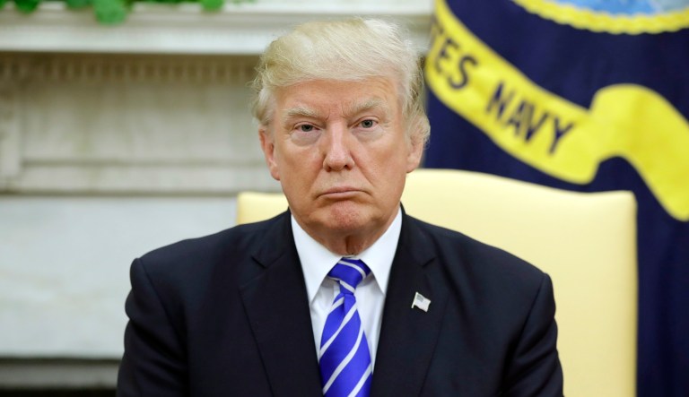 President Trump shows no sign of letting up on his criticism of NFL players who protest during the national anthem, reopening a rift over the athletes kneeling and drawing criticism for his handling of the racially charged issue. (AP Photo/Evan Vucci)