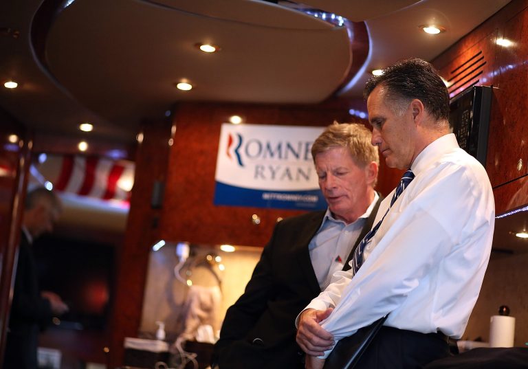 ETNA, OH - NOVEMBER 02:  Republican presidential candidate, former Massachusetts Gov. Mitt Romney (R) talks with advisor Stuart Stevens aboard his campaign bus en route to a campaign rally at Screen Machines Industries on November 2, 2012 in Etna, Ohio. With less than one week to go before election day, Mitt Romney is campaigning in Wisconsin and Ohio.  (Photo by Justin Sullivan/Getty Images)