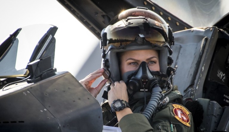 Capt. Zoe Kotnik, 55th Fighter Squadron pilot from Shaw Air Force Base, S.C., clips on her mask in her F-16 Fighting Falcon on Nov. 2, 2017, at Eglin Air Force Base in Florida.