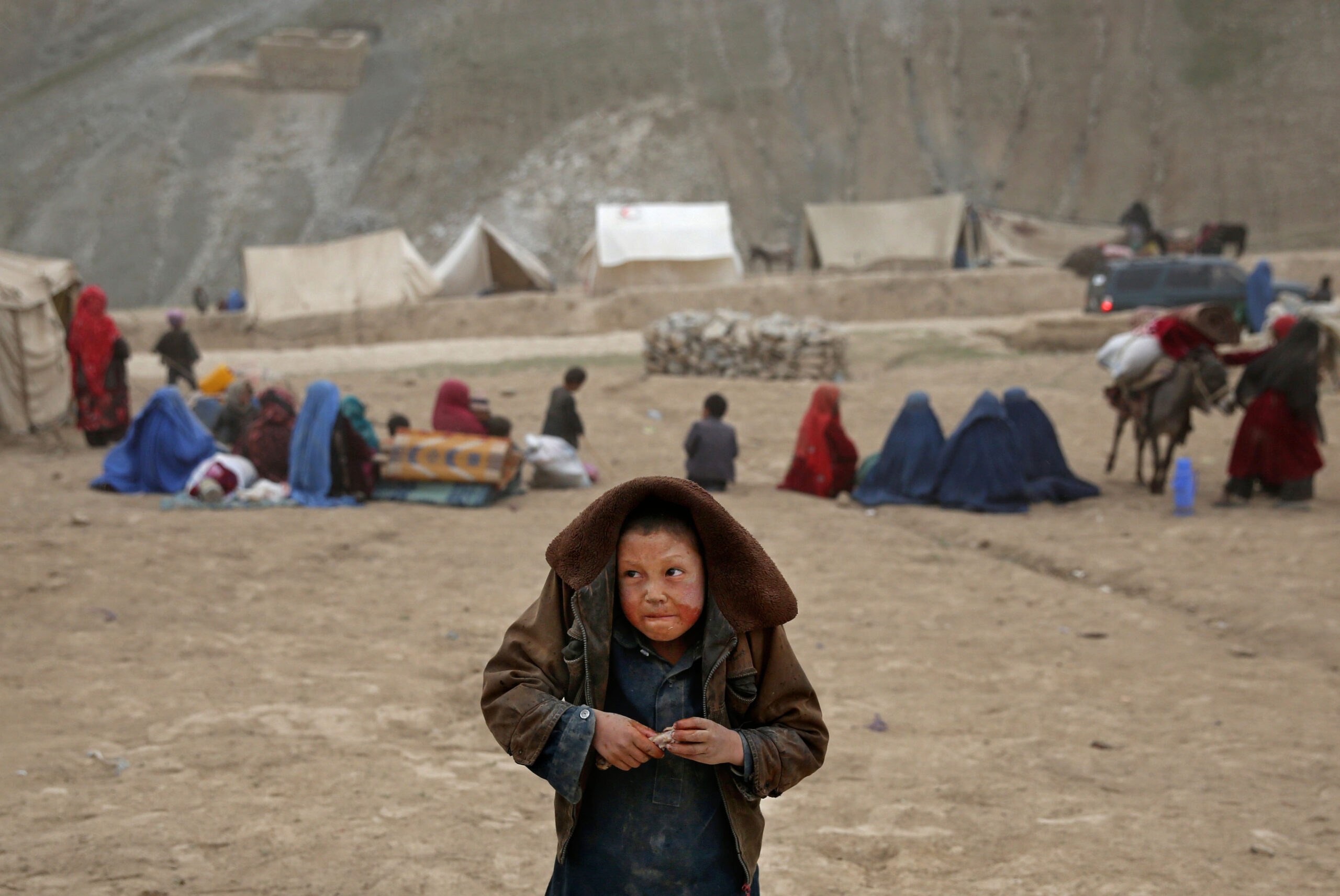 AP PHOTOS: Survivors struggle after Afghan slide