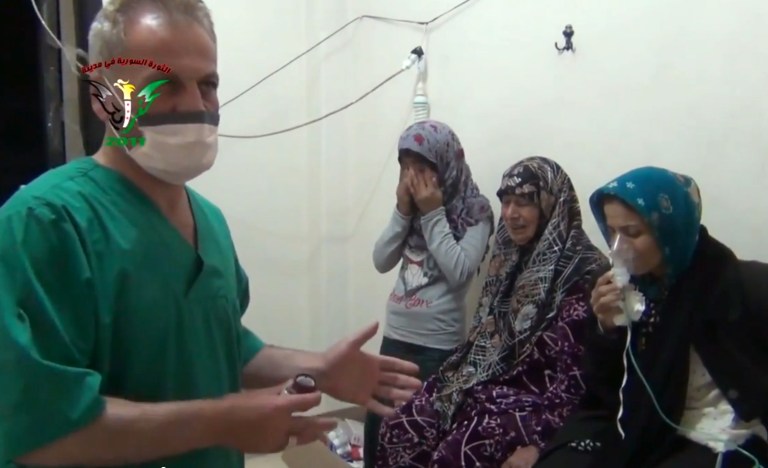 In this image taken from video obtained from the Shaam News Network, posted on April 18, 2014, an anti-Bashar Assad activist group, which has been authenticated based on its contents and other AP reporting, two women and a young girl are treated by a medic in Kfar Zeita, a rebel-held village in Hama province some 200 kilometers (125 miles) north of Damascus. Syrian opposition activists and other witnesses tell The Associated Press that Syrian government forces have attacked rebel-held areas with poisonous chlorine gas in recent months. They say the attacks left scores of men, women and children coughing, choking and gasping for breath. The reports have been denied by the Syrian government and have yet to be confirmed by any foreign country or international organization. But if true, they highlight the limitations of the global effort to rid Syria of its chemical weapons. (AP Photo/Shaam News Network)