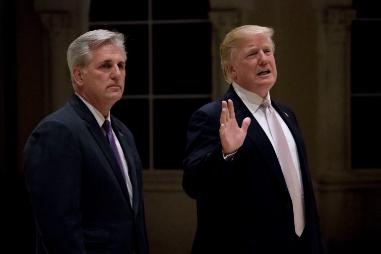 President Donald Trump, accompanied by House Majority Leader Kevin McCarthy of Calif., speaks to members of the media as they arrive for a dinner at Trump International Golf Club in in West Palm Beach, Fla., Sunday, Jan. 14, 2018.