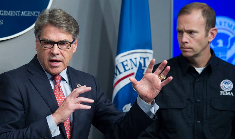 The two activists heckled Perry while he was delivering remarks in Washington, D.C., to the National Petroleum Council. (AP Photo/Cliff Owen)