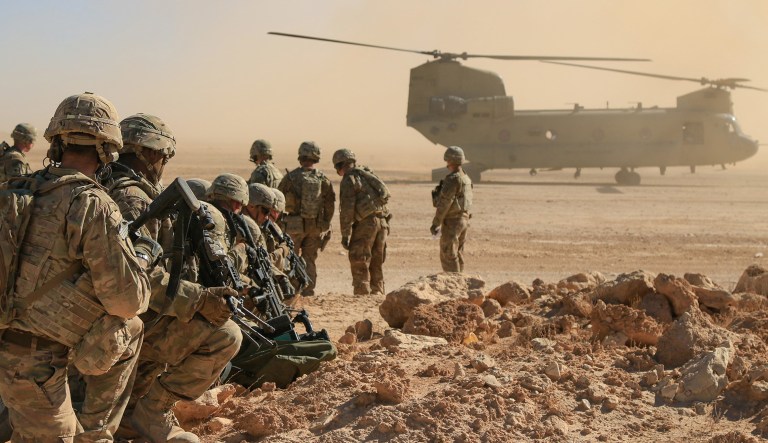 U.S. Soldiers assigned to Bandit Troop, 1st Squadron, 3rd Cavalry Regiment and deployed in support of Combined Joint Task Force â Operation Inherent Resolve await aerial extraction via CH-47 Chinook during an aerial response force live-fire training exercise in Iraq, Oct. 31, 2018. A number of training initiatives, collectively known as the Iraqi Air Enterprise, is underway across the Iraqi Air Force, Army Aviation, and Air Defense Commands. Continued growth towards Iraqi Security Forces (ISF) self-sufficiency will permit the Coalition to adjust the role and number of Coalition forces in Iraq in response to changing support requirements of the ISF.