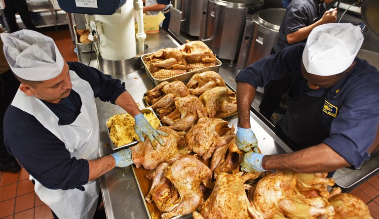 181121-N-YM543-380 
YOKOSUKA, Japan (Nov. 21, 2018) Sailors attached to the U.S. 7th Fleet flagship USS Blue Ridge (LCC 19) prepare turkeys for the ship's Thanksgiving celebration. Navy culinary specialists accross the fleet are preparing an estimated 112,000 pounds of roast turkey, 21,000 pounds of stuffing, 27,100 pounds of mashed potatoes, 18,500 pounds of sweet potatoes, 5,400 pounds of cranberry sauce, and 2,300 gallons of gravy.