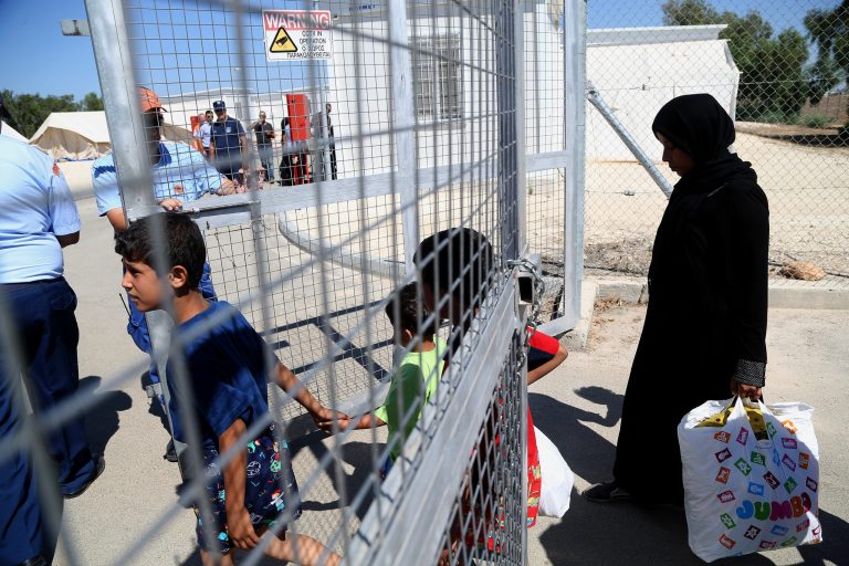 Migrants from Syria arrive at a refugee camp from Pyrgos village, in Paphos district, to Kokkinotrimithia outside the capital Nicosia, Cyprus, on Sept. 7. (AP Photo/Petros Karadjias)