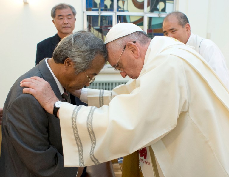 In this photo provided by the L' Osservatore Romano, Pope Francis baptizes Lee Ho Jin, the father of one of the children who died in South Korea's April ferry disaster, in Seoul, South Korea, Sunday, Aug. 17, 2014. (AP Photo/L' Osservatore Romano)