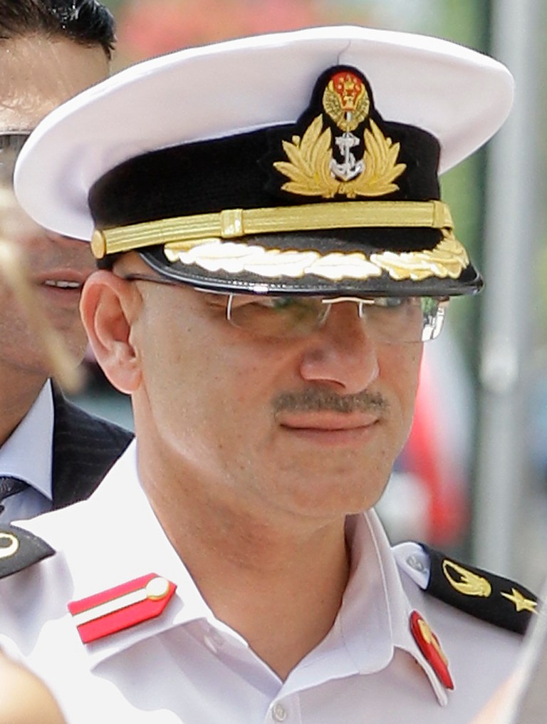  FILE - In this July 19, 2011 file photo, United Arab Emirates Col. Arif Mohamed Saeed Mohamed Al-Ali enters Federal Court in Providence, R.I. Al-Ali was ordered Wednesday, Dec. 26, 2012, to pay $1.2 million to former domestic worker Elizabeth Ballesteros, who accused him of imprisoning her and forcing her to work long hours for little pay. (AP Photo/Stephan Savoia, File)  