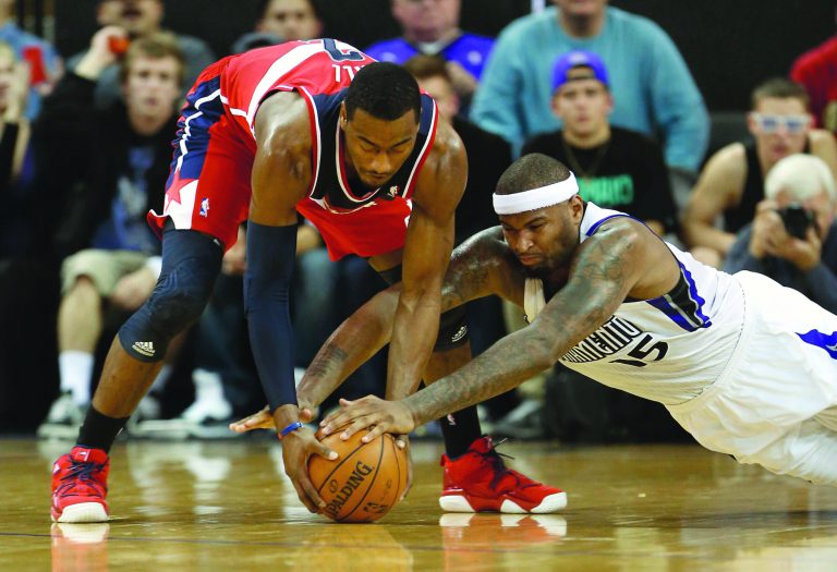 Rich Pedroncelli/AP
John Wall had 14 points and 10 assists in the Wizards' loss to the Kings on Wednesday night.
