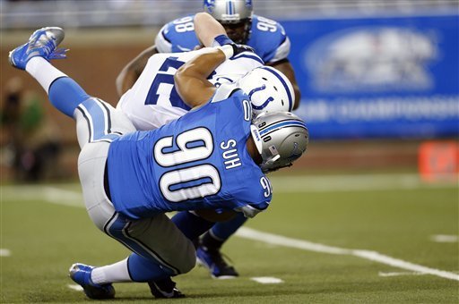 Detroit Lions defensive tackle Ndamukong Suh (No. 90) sacks Indianapolis Colts quarterback Andrew Luck (No. 12) in the first quarter of Sunday's game in Detroit. (AP Photo/Rick Osentoski)