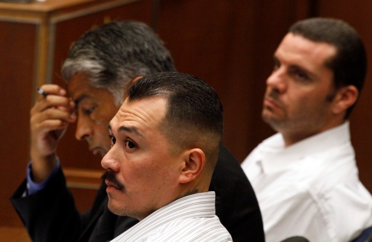   Marvin Norwood, right, his attorney Victor Escobedo and co-defendant Louie Sanchez listen during preliminary proceedings on Friday, June 8, 2012 in Los Angeles County Superior Court. The transcript of the talk between Louie Sanchez, 30, and co-defendant Marvin Norwood, 31, was released after a preliminary hearing where both men were ordered to stand trial on charges of mayhem, assault and battery in the 2011 attack on Bryan Stow. The men spoke after they had appeared in a lineup. (AP Photo/Los Angeles Times, Irfan Khan, Pool)  