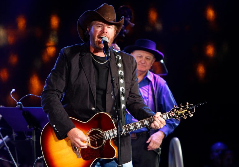 FILE - In this Oct. 30, 2012, file photo Toby Keith performs at the 60th Annual BMI Country Awards on in Nashville, Tenn. Keith, whose hometown of Moore, Okla., was hit by a massive tornado in May, announced Thursday, June 13, 2013, that his Oklahoma Twister Relief Concert will be held July 6 at the University of Oklahoma's Gaylord Family-Oklahoma Memorial Stadium in Norman. Joining Keith is fellow Oklahoman Garth Brooks and his wife, Trisha Yearwood. Other performers include Willie Nelson and Ronnie Dunn. (Photo by Wade Payne/Invision/AP, File)