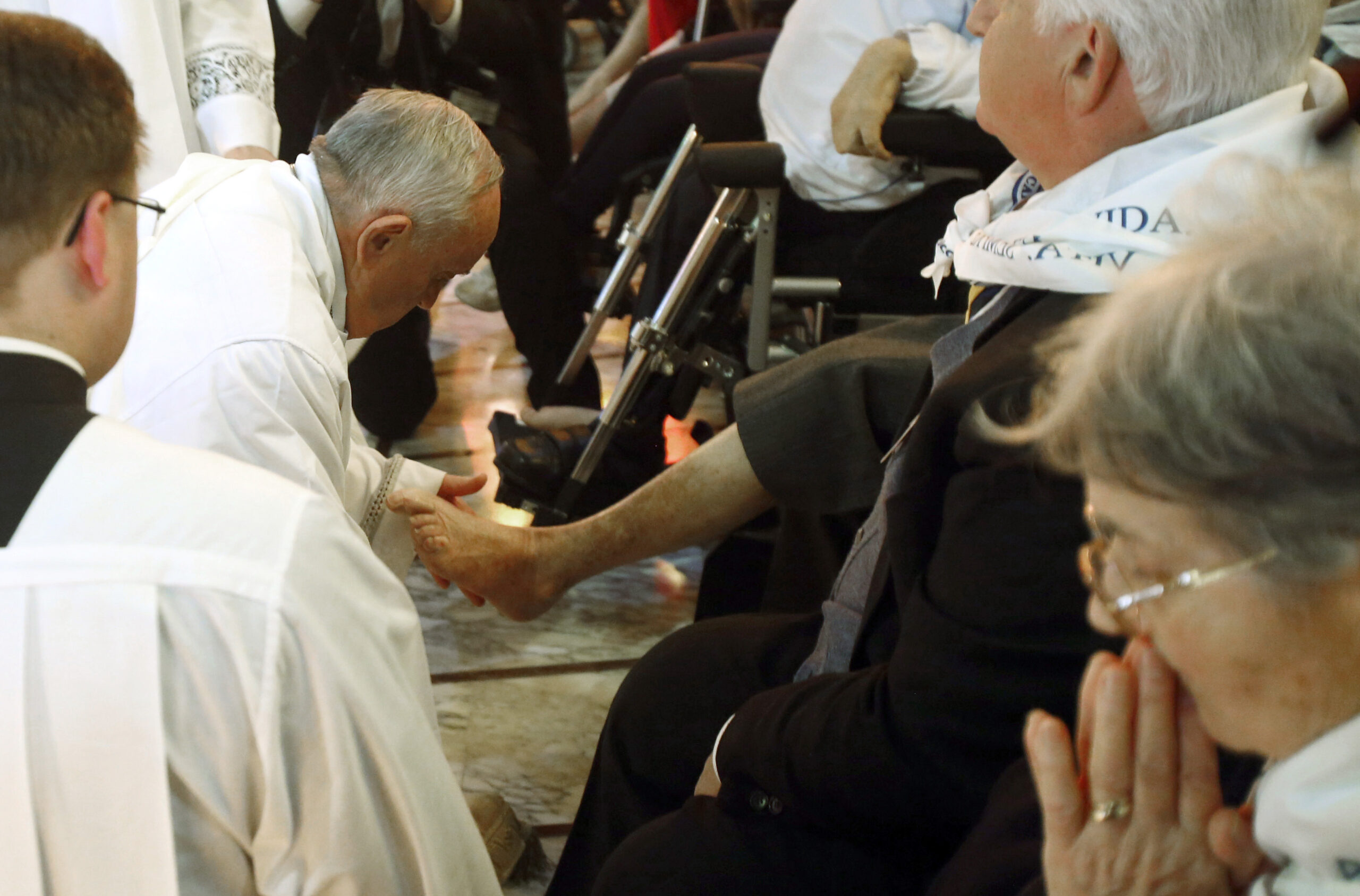 Pope washes feet of elderly, disabled in rite
