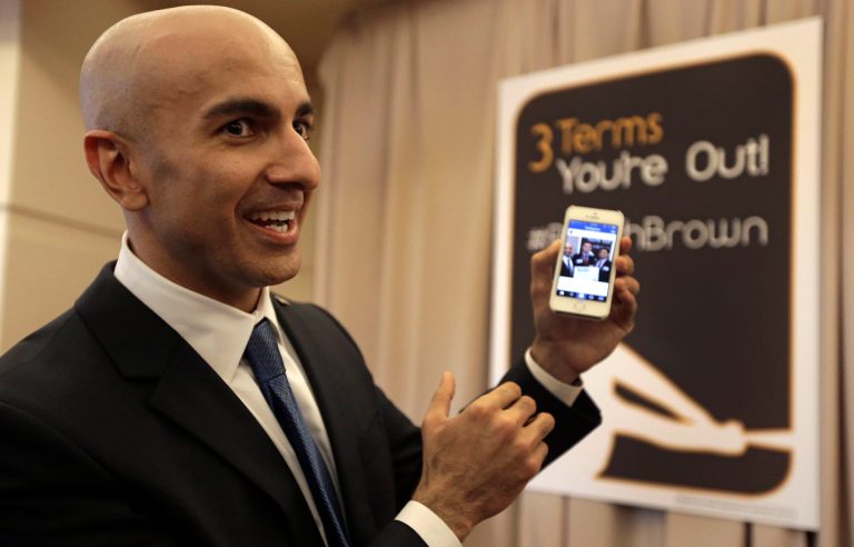 FILE -- In this March 14, 2014 file photo, Gubernatorial candidate Neel Kashkari displays a campaign video posted to Instagram at the California Republican Party 2014 Spring Convention in Burlingame, Calif. Kashkari, a former U.S. Treasury official who has never held elective office, is challenging incumbent Gov. Jerry Brown in the November election.(AP Photo/Ben Margot, file)
