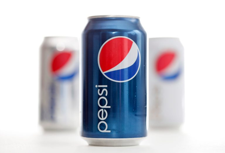 FILE - This Oct. 10, 2011 file photo shows cans of Pepsi, posed in Philadelphia. PepsiCo Thursday April 17, 2014 reported a stronger-than-expected first-quarter profit as the company slashed costs and sold more snacks around the world.  (AP Photo/Matt Rourke, File)