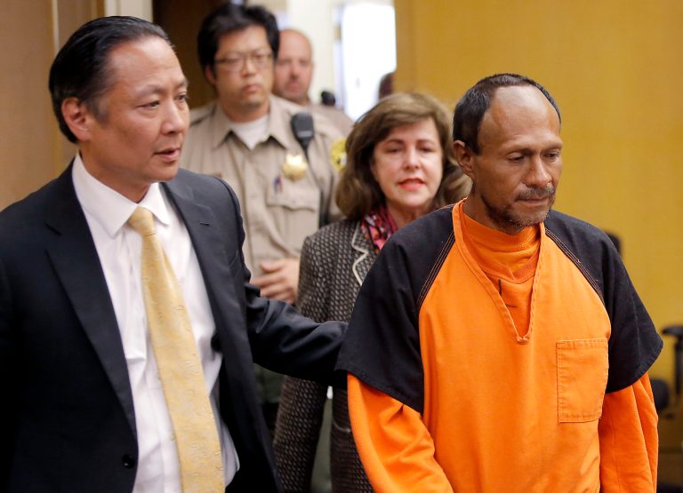 In this July 7, 2015 file photo, illegal immigrant Juan Francisco Lopez-Sanchez, right, is lead into the courtroom by San Francisco Public Defender Jeff Adachi, left, and Assistant District Attorney Diana Garciaor, center, for his arraignment at the Hall of Justice in San Francisco. He was the suspect at the center of a national immigration debate over the murder of Kate Steinle on San Francisco's Pier 14, on July 1. (Michael Macor/San Francisco Chronicle via AP, Pool, File)