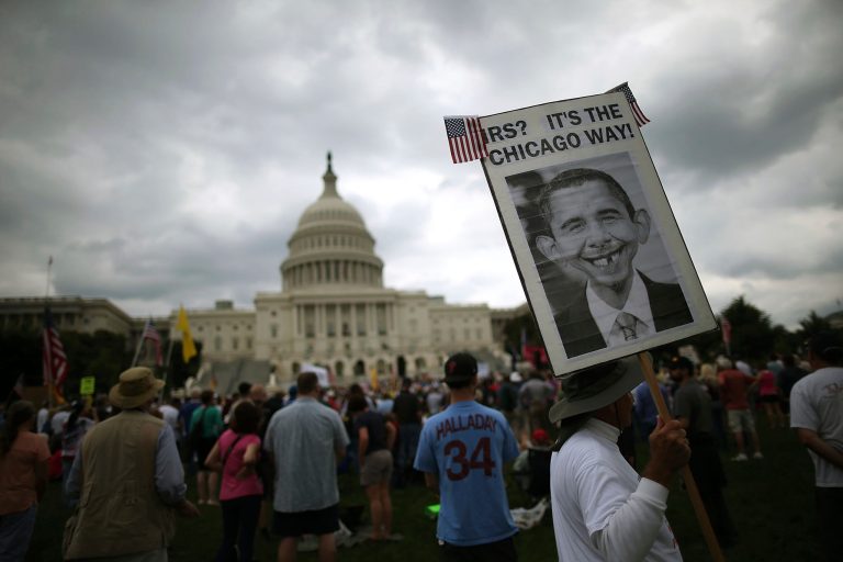 People attend a Tea Party rally in front of the U.S. Capitol. (Mark Wilson/Getty Images)
