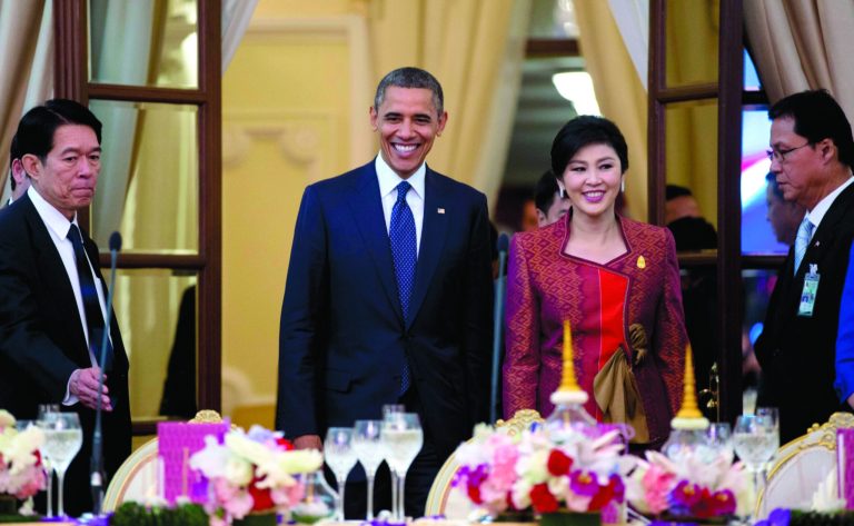 U.S. President Barack Obama, second left, and Thai Prime Minister Yingluck Shinawatra, second right, arrive for an official dinner at Government House in Bangkok, Thailand, Sunday, Nov. 18, 2012. (AP Photo/Carolyn Kaster)