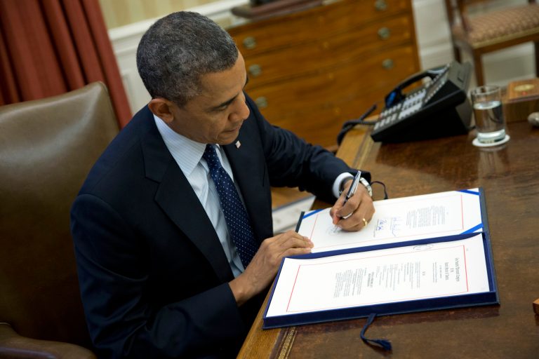 President Barack Obama signs a bill in the Oval Office of the White House on Wednesday, Nov. 27, 2013 in Washington. According to the White House, President Obama signed S. 252 : Prematurity Research Expansion and Education for Mothers who deliver Infants Early Reauthorization Act or the 