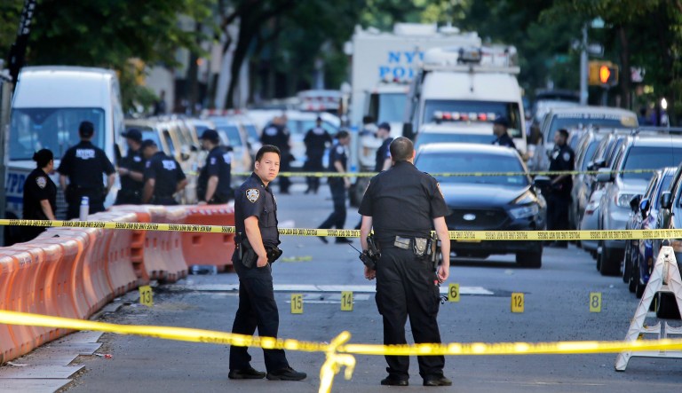 Police say a 12-year veteran New York City officer was fatally shot while sitting in her patrol car with her partner in what one sergeant is calling a 