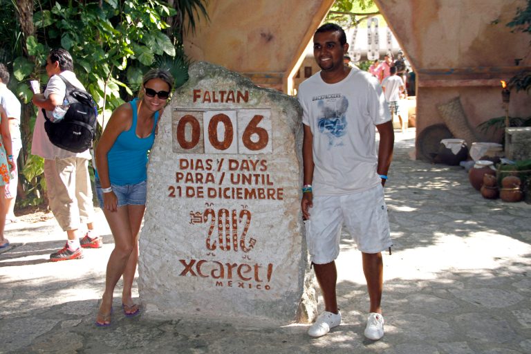  Tourists get their picture taken next to a slab of stone counting down the days until Dec. 21, 2012 at the Xcaret theme park in Playa del Carmen, Mexico, Saturday, Dec. 15, 2012. Amid a worldwide frenzy of advertisers and new-agers preparing for a Maya apocalypse, one group is approaching Dec. 21 with calm and equanimity calm: the people whose ancestors supposedly made the prediction in the first place. Mexico's 800,000 Mayas are not the sinister, secretive, apocalypse-obsessed race they've been made out to be. (AP Photo/Israel Leal)  