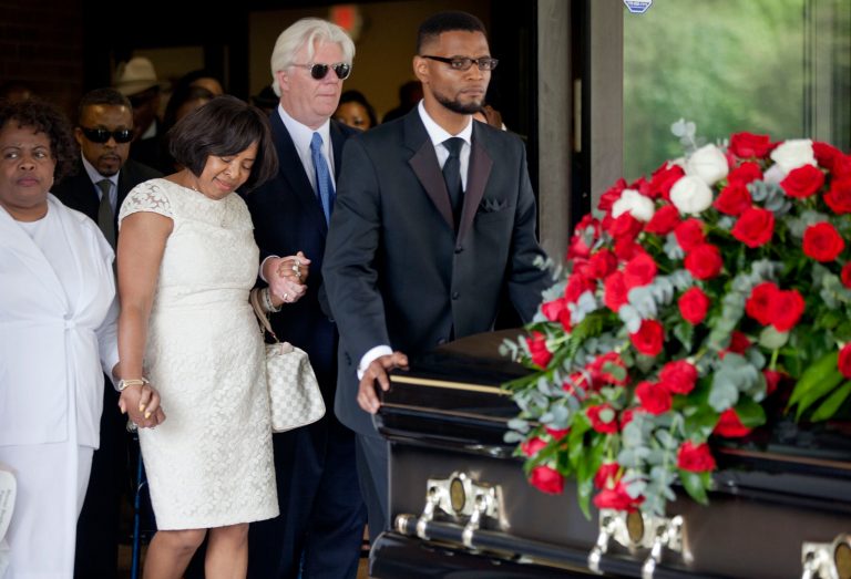 Donna Kelly Pratte, second from left, the mother of Kris Kross rapper Chris Kelly, follows the casket of her son during his funeral recessional along with her husband James Pratte, second right, Thursday, May 9, 2013, in Atlanta. The 34-year-old Kelly was found dead May 1 of a suspected drug overdose. Kriss Kross was introduced to the music world in 1992 by music producer and rapper Jermaine Dupri after he discovered the pair at a mall in southwest Atlanta. Kelly performed alongside Chris Smith, who known as 