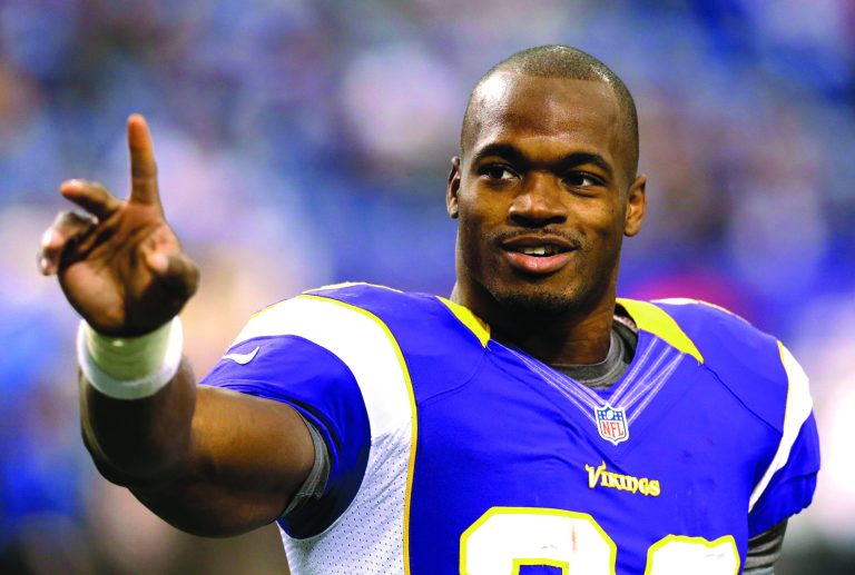 Charlie Neibergall/AP
Minnesota Vikings running back Adrian Peterson leads the NFL with 1,128 rushing yards.