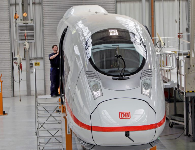 FILE - The April 28, 2010 file photo shows a worker assembling the doors at a new ICE high speed train, the ICE 3, at the train plant of Siemens in Krefeld, western Germany. German industrial equipment maker Siemens AG is launching a sweeping restructuring to raise profits and better compete with peers such as General Electric. as the company announced Wednesday, May 7, 2014. (AP Photo/Frank Augstein, file)