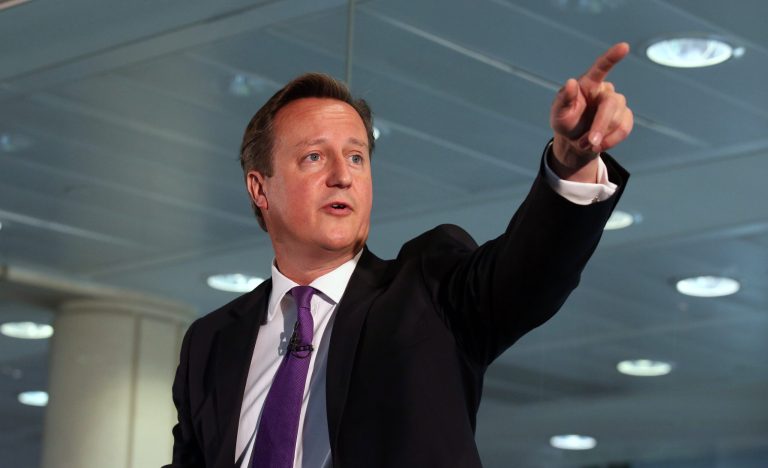 Britain's Prime Minister, David Cameron, points whilst speaking during a visit to a financial office in Edinburgh, Wednesday Sept. 10, 2014, where he made an impassioned plea to keep Scotland part of the union, saying he would be 