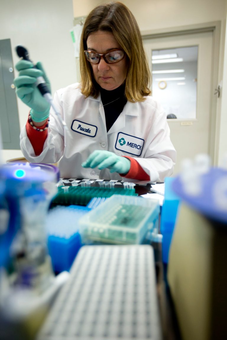 In this Thursday, Feb. 28, 2013 photo, Merck scientist Pascale Nantermet conducts research to discover new HIV drugs in West Point, Pa. Merck reports quarterly financial results on Tuesday, July 29, 2014. (AP Photo/Matt Rourke)