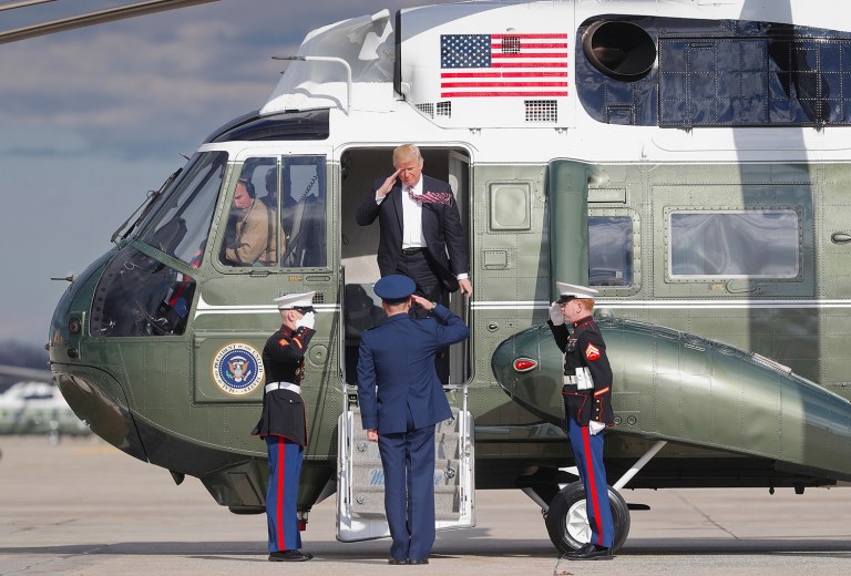 President Donald Trump returns a salute as he steps off Marine One helicopter before boarding Air Force One for his departure from Andrews Air Force One, Md., Thursday, Jan. 26, 2017. Trump is traveling to Philadelphia to speak at the House and Senate GOP lawmakers at their annual policy retreat. (AP Photo/Pablo Martinez Monsivais)