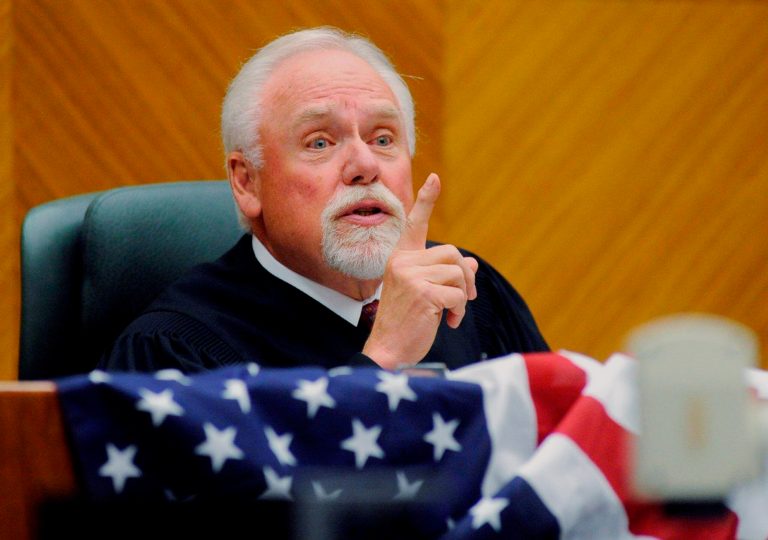 FILE - In this June 23, 2011, file photo, Chief Judge Richard F. Cebull makes a speech during a naturalization ceremony at the federal courthouse in Billings, Mont.  A group of American Indians wants a court to preserve and eventually release an investigative file containing inappropriate emails sent by Cebull including a racist message involving President Barack Obama. A judicial review panel found he sent hundreds of emails from his federal account that showed disdain for blacks, Indians, Hispanics, women, certain religions and others. He was publicly reprimanded and retired. (AP Photo/Billings Gazette, James Woodcock, File)