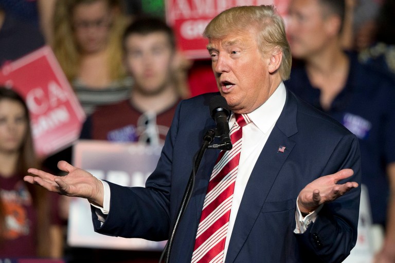 Donald Trump tweeted Thursday morning forcefully denying accusations that he groped and kissed women without their consent in news stories that emerged late Wednesday night. (AP Photo/Steve Helber, File)
